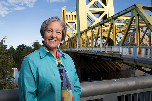 Casual business headshot at the Sacramento Bridge near old town Sacramento.