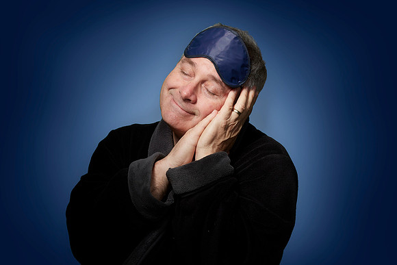 Studio Portrait of Gerry McIntyre on a blue gradient background at The GMP studio in Downtown Sacramento.