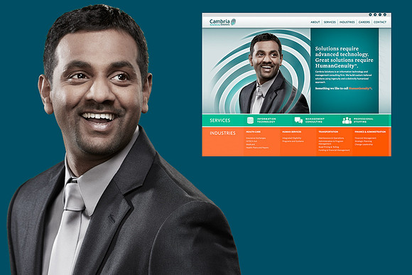 An executive portrait of a man smiling widely looking up and off in a suit . There is another image of the man on Cambria's website showing how the portrait was used by the client